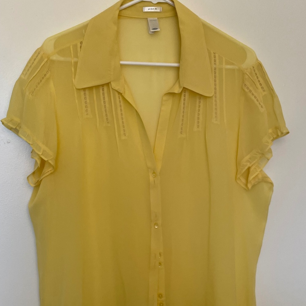 Yellow silk blouse.